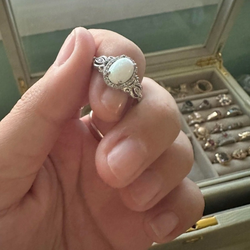 Intricate Silver Ring with White Gemstone
